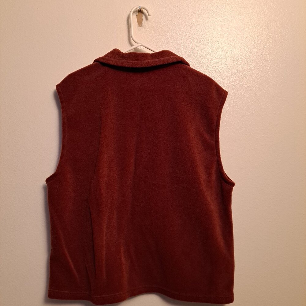 Columbia fleece vest in a burnt orange or rust color. - Picture 2 of 7